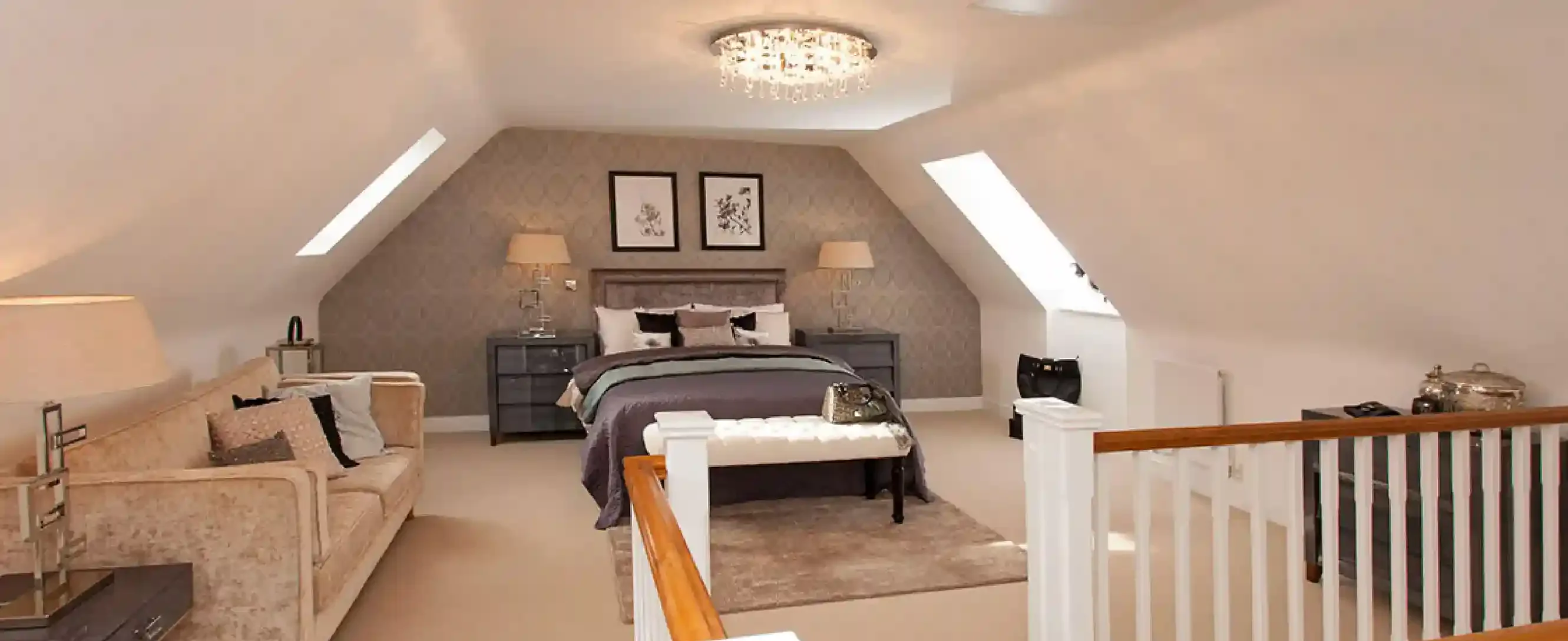 Modern loft conversion in London with elegant bedroom setup, skylights, and quality finish by Pino Construction Ltd.